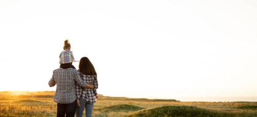 Mother, father, and daughter child at sunset - Estate planning for families concept